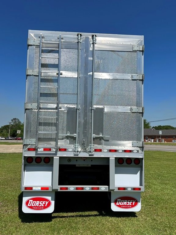 Rear view of a silver Dorsey chip van trailer with ladder, doors and mudflaps visible.