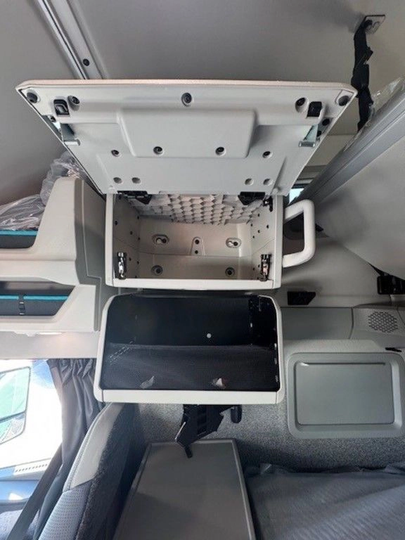 Overhead view inside the Volvo VNL sleeper showing storage compartment access and interior shelving.