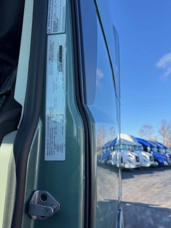 Close-up of the Volvo VNL door jamb label for vehicle specifications and compliance details.