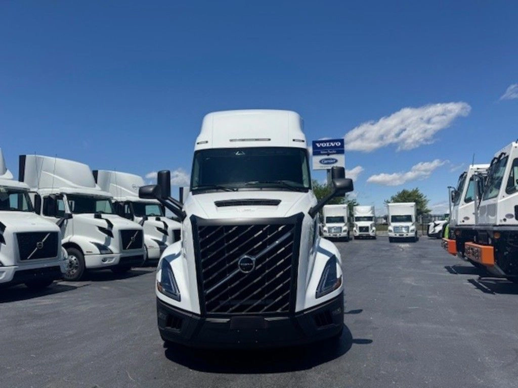 Front view of the white 2025 Volvo VNL660 sleeper tractor with Volvo grille and high-roof cab.