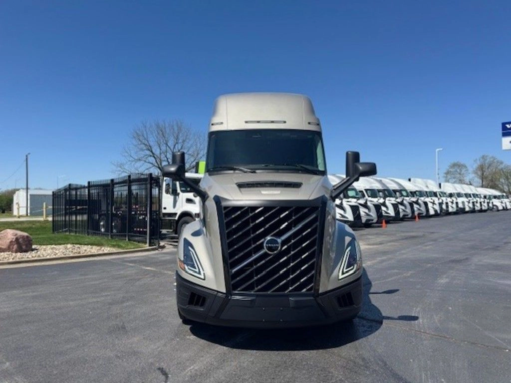 Front view of a gray Volvo VNL sleeper tractor showing grille, headlights and aerodynamic cab styling.