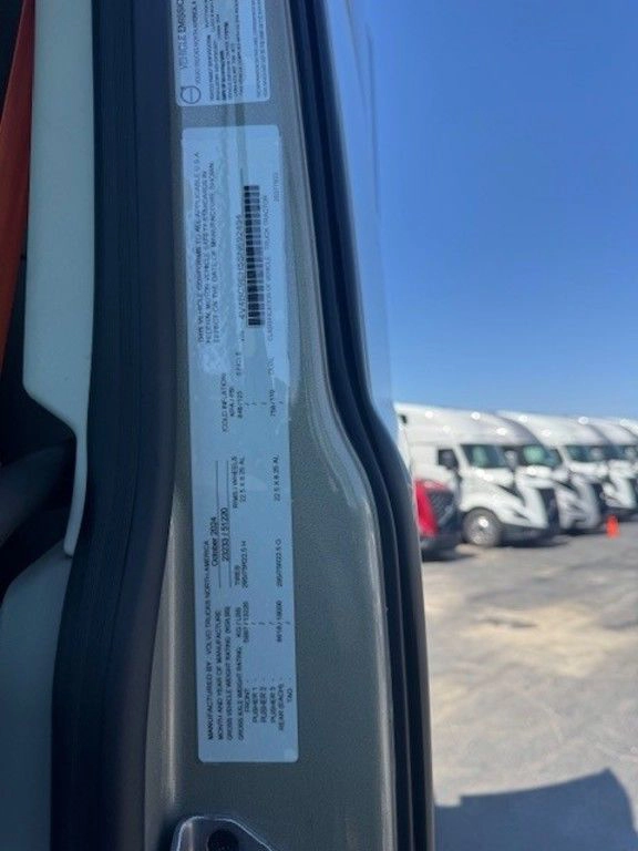 Close-up of the Volvo VNL door jamb label with vehicle specifications and compliance information.