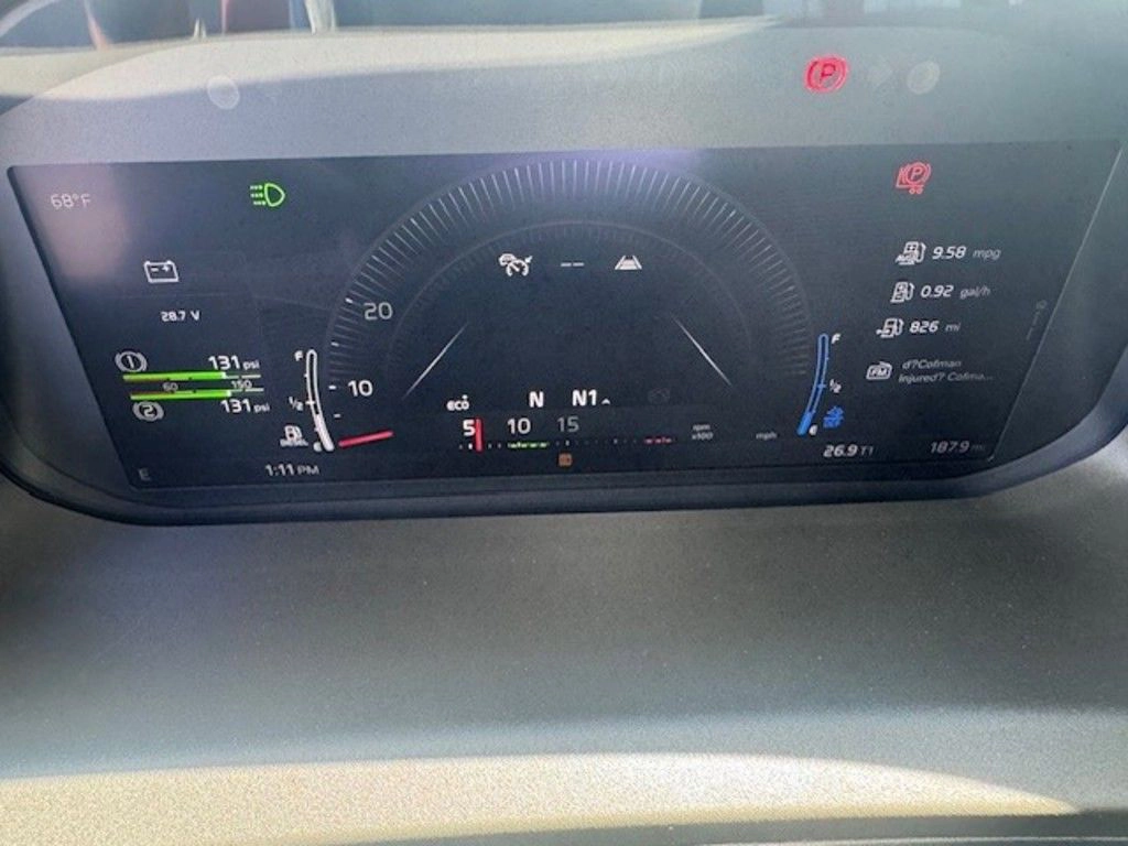 Volvo VNL digital instrument cluster showing speed, fuel, gear status and driver information displays.