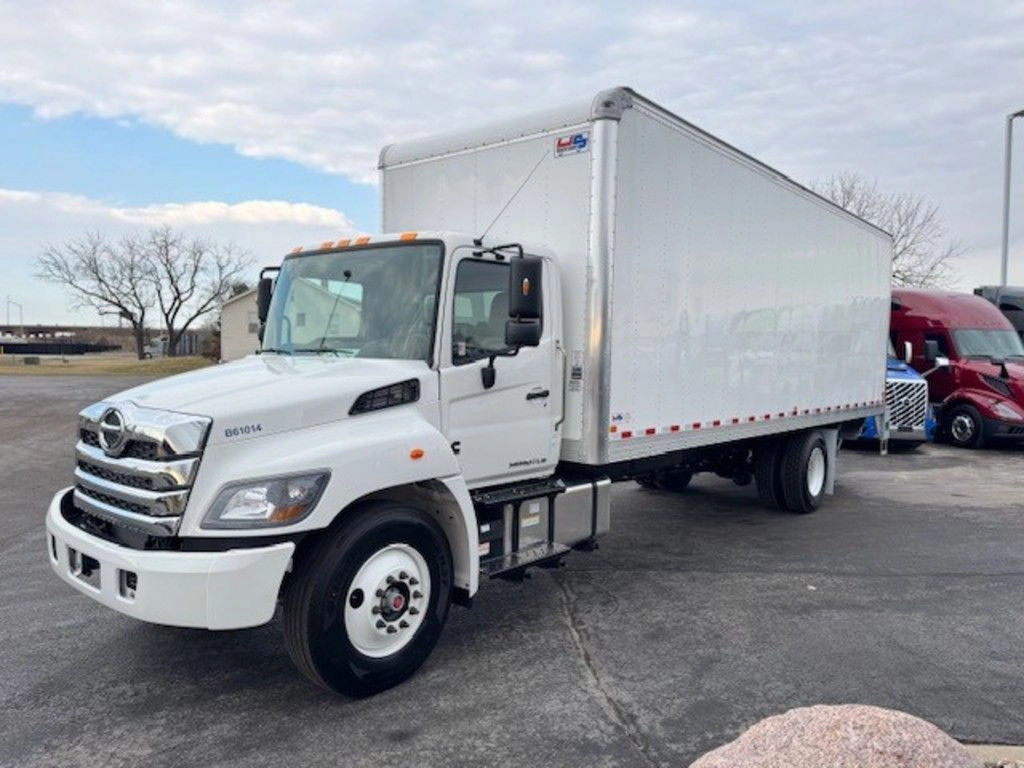 White Hino L6 box truck shown from the front passenger side with cargo body and day cab visible.